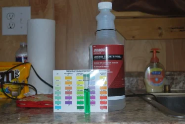 ammonia bottle with test tube.webp