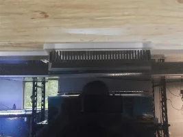 Filtration for an acrylic with a central overflow box.