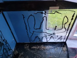 Removing silicone from glass